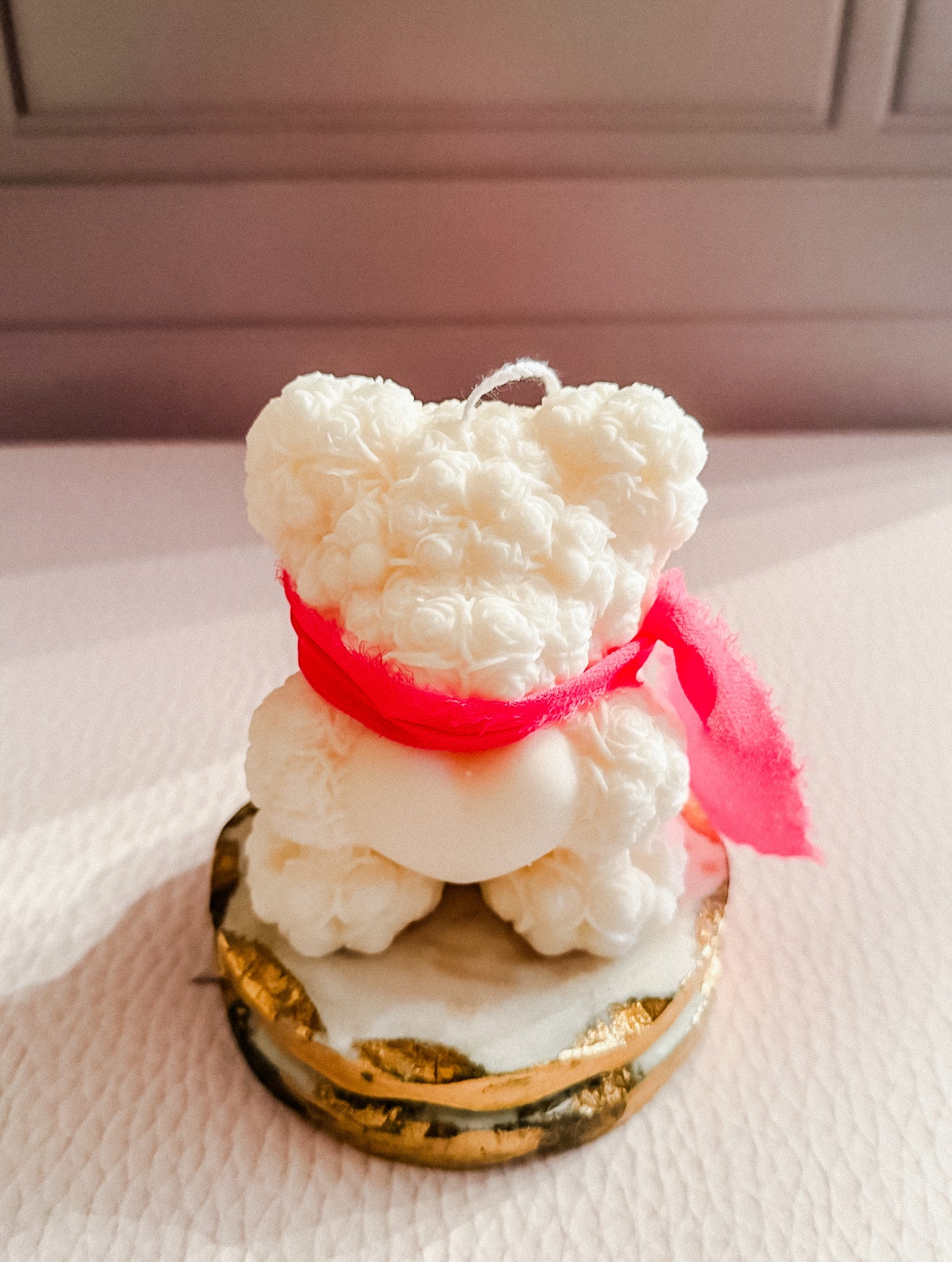 Heart holding bear candle with scarf