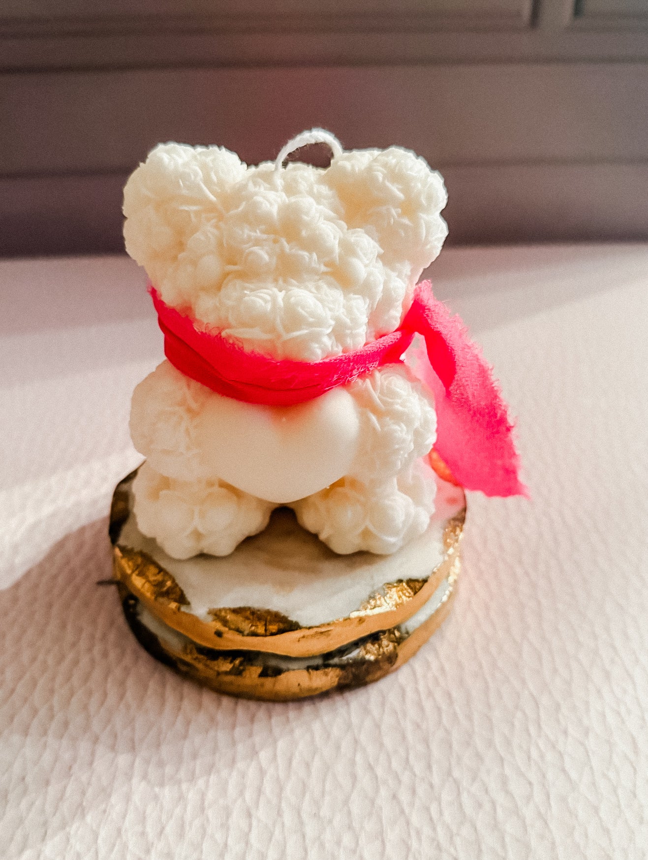 Heart holding bear candle with scarf